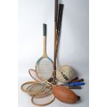 A collection of 1940s 50s and 60s vintage sports equipment to include Badminton rackets to include