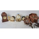 A collection of vintage and retro 20th century clocks to include Cuckoo clocks, travel clocks such
