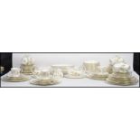 An extensive Royal Doulton twelve person setting dinner service in the ' Yorkshire Rose ' pattern