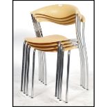 A set of 4 stacking chairs by Brune Dreki in yello