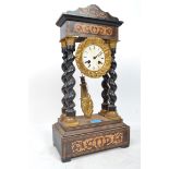 A French ormolu mounted ebonised portico mantel clock, 19th century, the silvered dial enclosing a