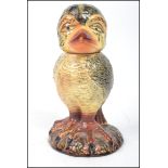 An unusual 20th century ceramic tobacco jar canister in the form of a grotesque bird being  in the