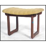 A 1960's teak dressing table stool having an unusual seat being raised on teak quadrille style legs.