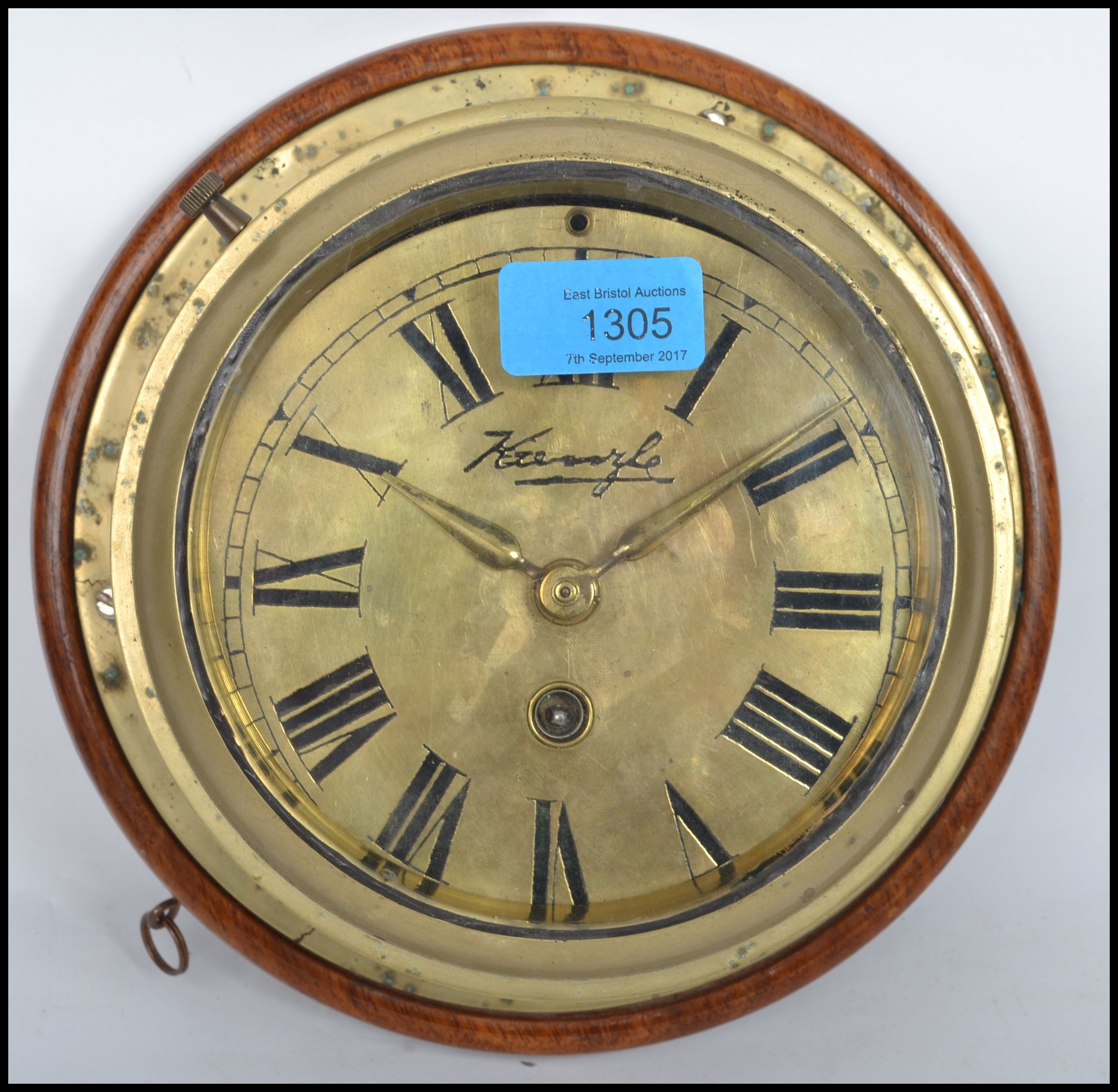 A early 20th century brass bulkhead nautical ships clock having a roman numeral chapter ring, - Image 2 of 5