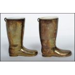 A pair of 20th century silver plated boot measures for spirits. Complete with the white inner