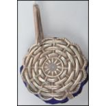 A vintage sterling silver ladies pin cushion on bail in the form of a wicker wheel with a blue baize