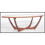 A 1970's teak G Plan style atomic coffee table in