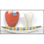 A group of three mid century retro ceramics to include a SylvaC orange wall pocket 2140 5, a