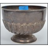 A silver hallmarked pedestal scalloped rose bowl bearing London assay marks, makers marks and date