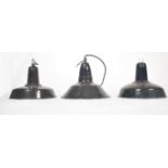 A set of 3 mid century Industrial factory pendant lights of saucer form in a two tone colourway of