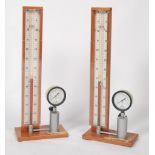 A pair of  tall Industrial mid century gauges being designed to test gas having central phials