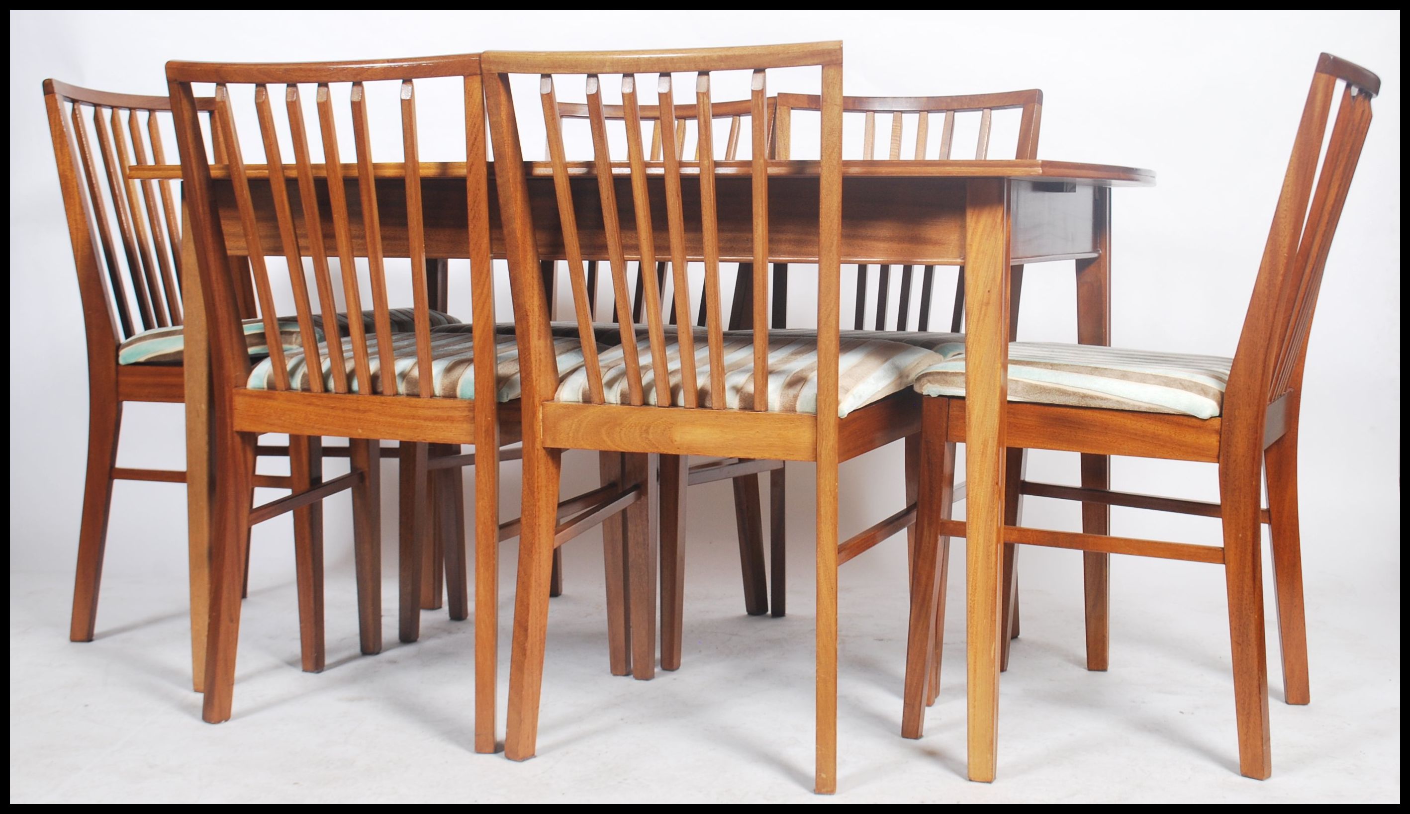 A good mid century / 1950's  dining table and chairs suite by Pete Hayward for Vanson. The extending