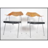 A pair of Italian chrome and walnut panel back laminate carver armchairs in the manner of