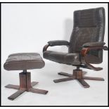 A Danish brown leather reclining swivel chair together with an ottoman / footstool by Kebe both