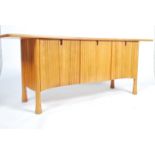 A rare 20th century Ercol ' Saville pattern ' elm sideboard The oversized the plank top raised  over