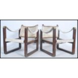 A pair of mid century bentwood and pony hide / skin safari chairs in the manner of Kaare Klint. Each