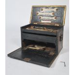 A mid century work / tool box comprising of an ebonised oak frame being brass bound. The interior