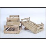 A collection of 5 unusual wooden mid century apple crates of slatted construction having carry