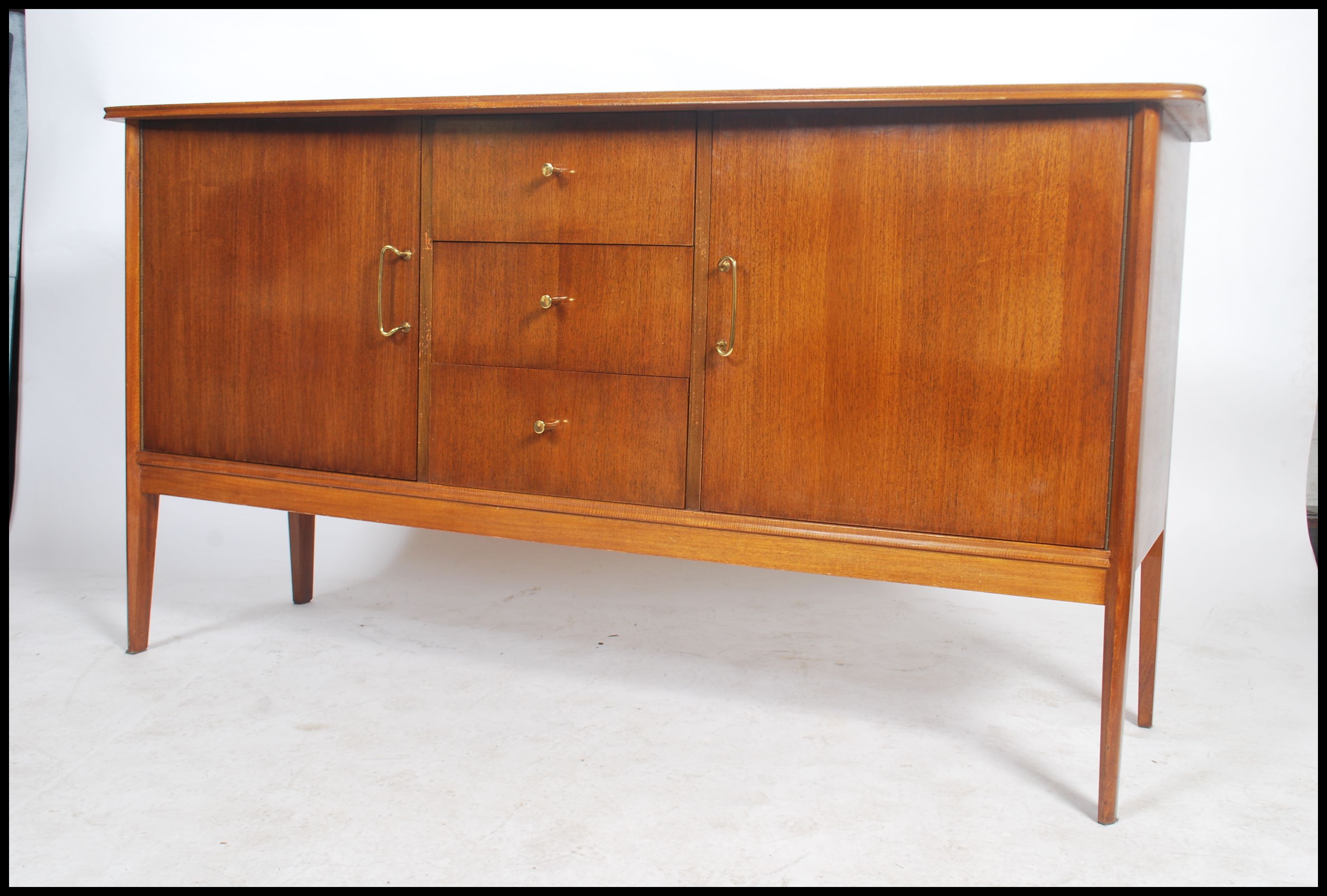 A good mid century / 1950's  sideboard by Pete Hayward for Vanson. The sideboard raised on tapered