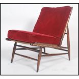 An Ercol ' Windsor ' pattern beech wood open framed chair - armchair. Raised on turned legs with