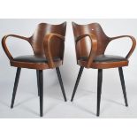 An exceptional pair of Danish mid century armchairs in the manner of Cherner for Plycraft. Each