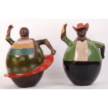 A pair of unusual large Peruvian terracotta handpainted oversized character figurines of a lady
