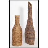 A collection of fabulous large 20th century interior floor standing whicker basket amphora's of