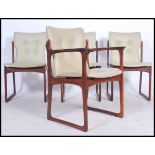 An exceptional set of Danish dining chairs from the mid 20th century being shaped and chamfered to