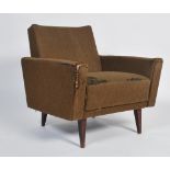 A mid century retro armchairs - wedge chair being raised on turned and tapering legs with angular