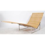 After Poul Kjærholm. A  chaise longue lounger model no  PK24 designed by Poul Kjaerholm originally