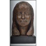 A 20th century plaster study bust of a young lady being raised onto square plinth wooden ebonised