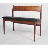 A believed mid century Frem Rojle mid century Danish bench seat being raised on tapering legs with