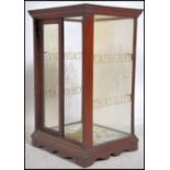 An early 20th  Cadbury's Chocolate shop advertising table top glass display cabinet, The oak frame