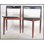 A pair of mid century Danish teak wood dining chairs designed by Hans Olsen for Frem Rojle. Black