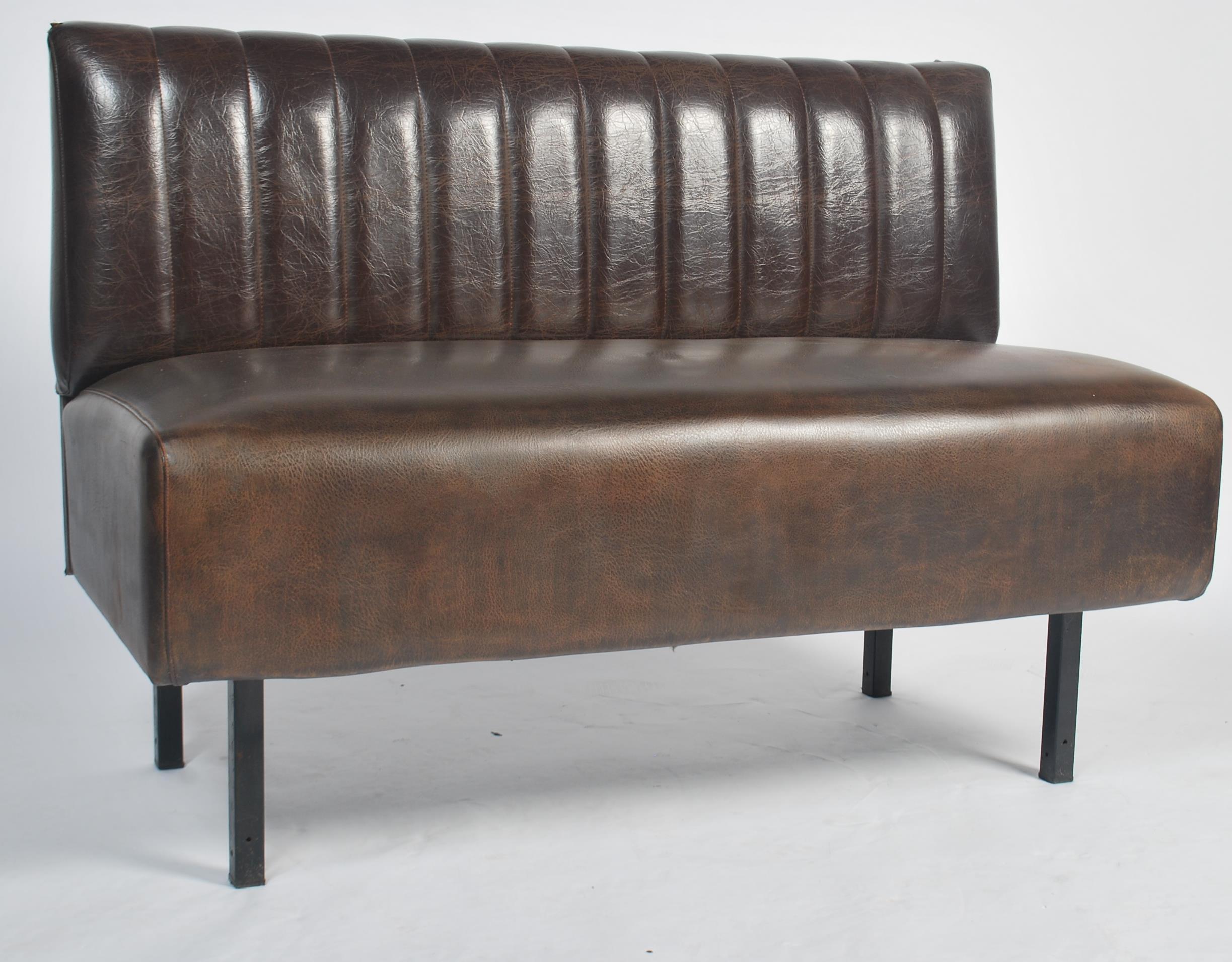 An unusual mid century Industrial French bust / coach seat being raised on a tubular metal