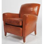 An exceptional 1930's Art Deco tan brown leather French club armchair being raised on leather