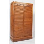 A tgood 20th century retro mid century Industrial tambour fronted tall narrow teak tambour front