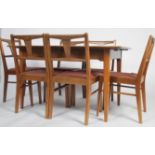 A good mid century Alfred Cox walnut / laurel wood extending dining table and 6 chairs suite. The