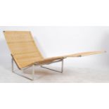 After Poul Kjærholm. A  chaise longue lounger model no  PK24 designed by Poul Kjaerholm originally