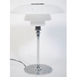 After Poul Henningsen. A stunning PH80 model table lamp having chrome terraced base and support with
