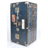 A good early 20th century fitted travel chest - wardrobe in blue with original shipping labels for