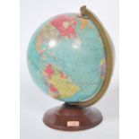 A vintage 20th century Replogle 12" tin plate based desk top precision globe. Good colours with faux