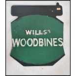 An early 20th century painted double sided metal advertising sign for Wills Woodbine cigarettes in a