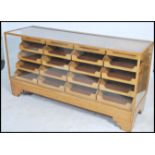 A stunning early 20th century Art Deco twenty drawer vintage haberdashery shop display cabinet