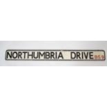 An original 20th century cast metal street sign for Northumbria Drive BS9 (Bristol) having black