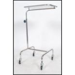 An original mid century Industrial surgeons raised  trolley tray stand of tubular metal and