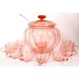 A retro 1950's pumpkin shaped cranberry flash glass coloured punch bowl and lid complete with the