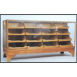 A stunning early 20th century sixteen drawer vintage haberdashery shop display cabinet counter