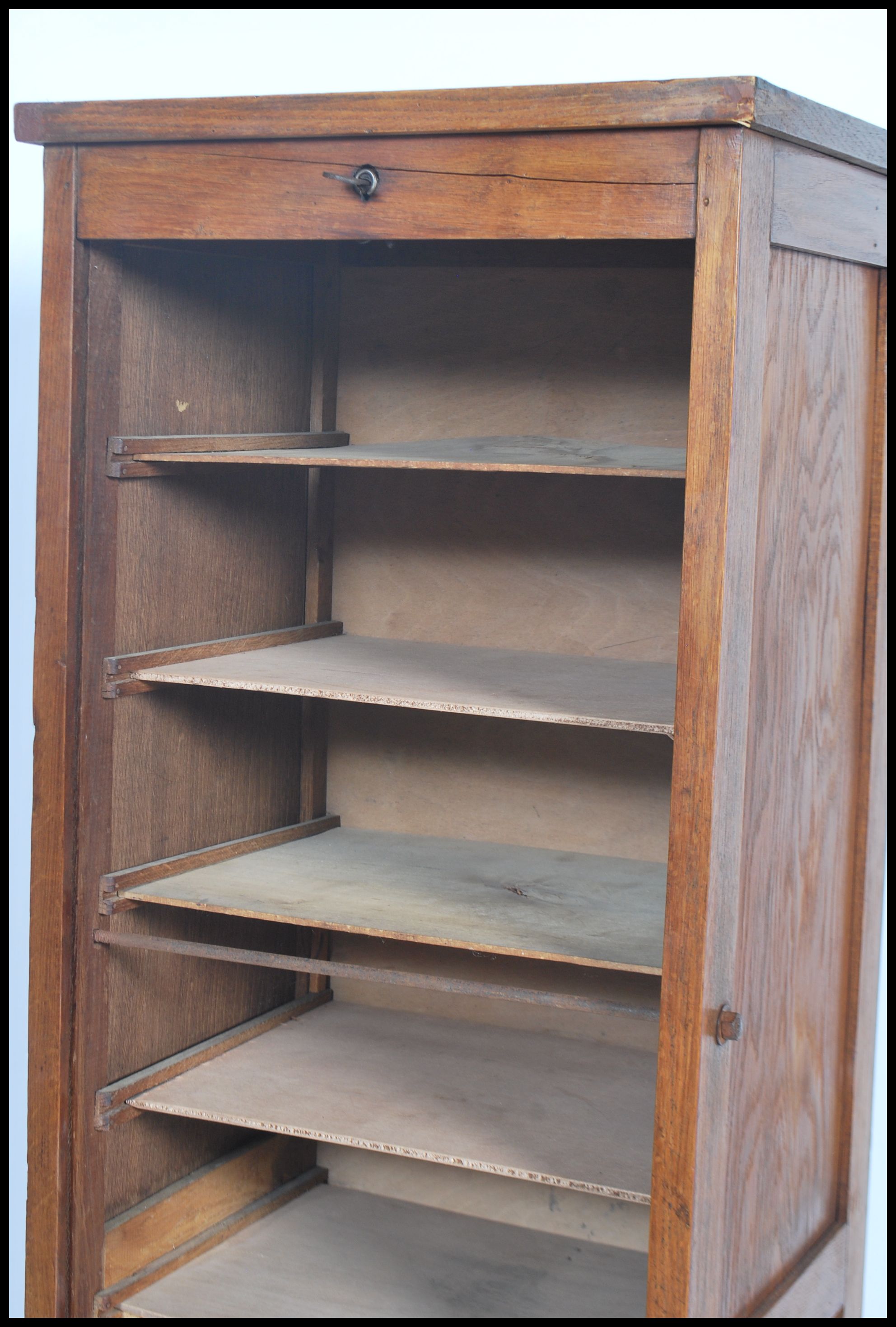 A 1920's oak tall  tambour fronted office Industrial filing cabinet raised on plinth base with - Image 3 of 4