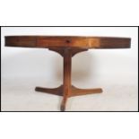 A mid century retro Robert Heritage for Archie Shine large drum shaped dining table. The round top